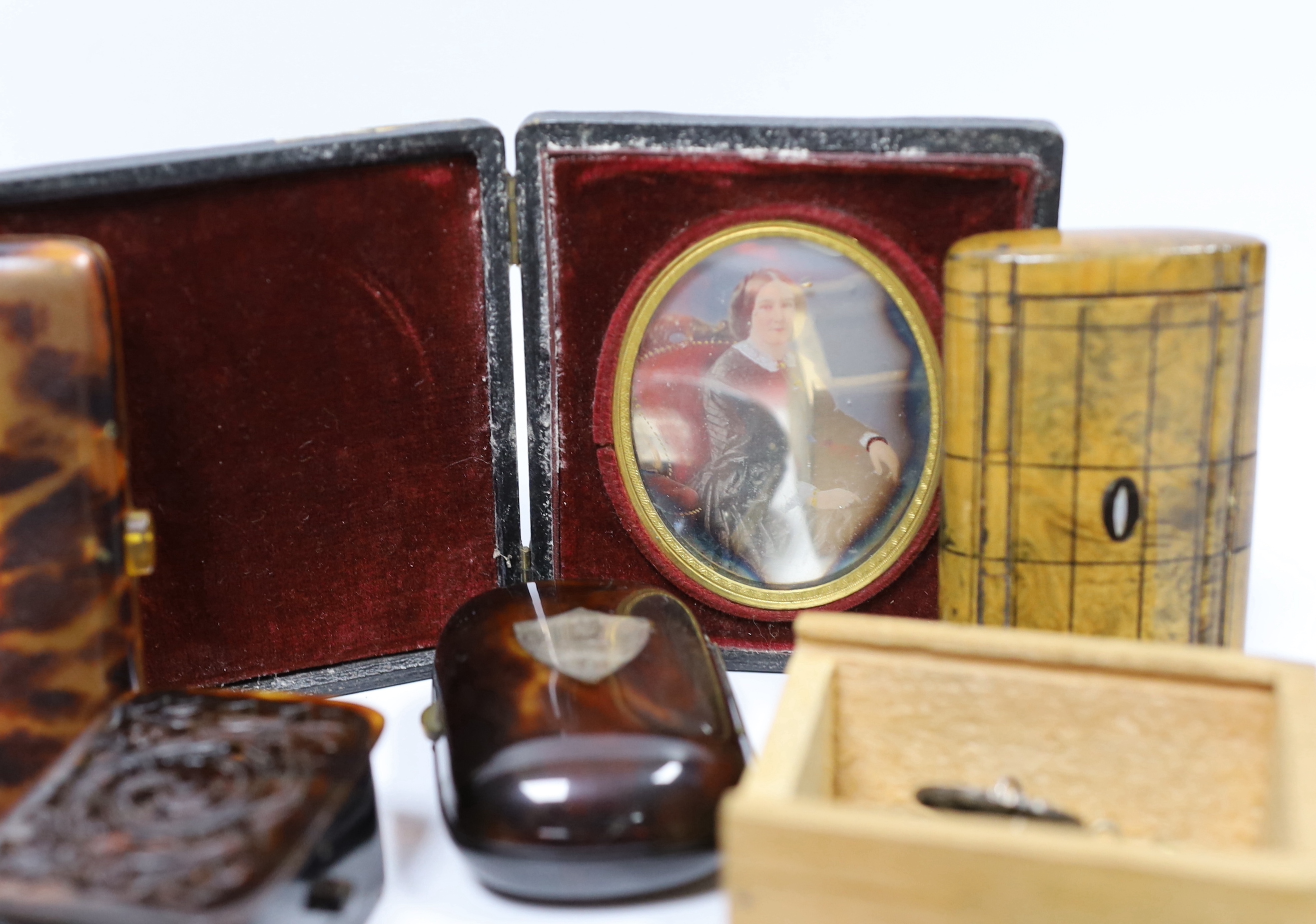 A group of vertu to include an unusual Victorian white metal mounted green glass combination scent bottle and whistle, a group of Art Nouveau silver buttons, carved tortoiseshell boxes, a double ended scent bottle etc.